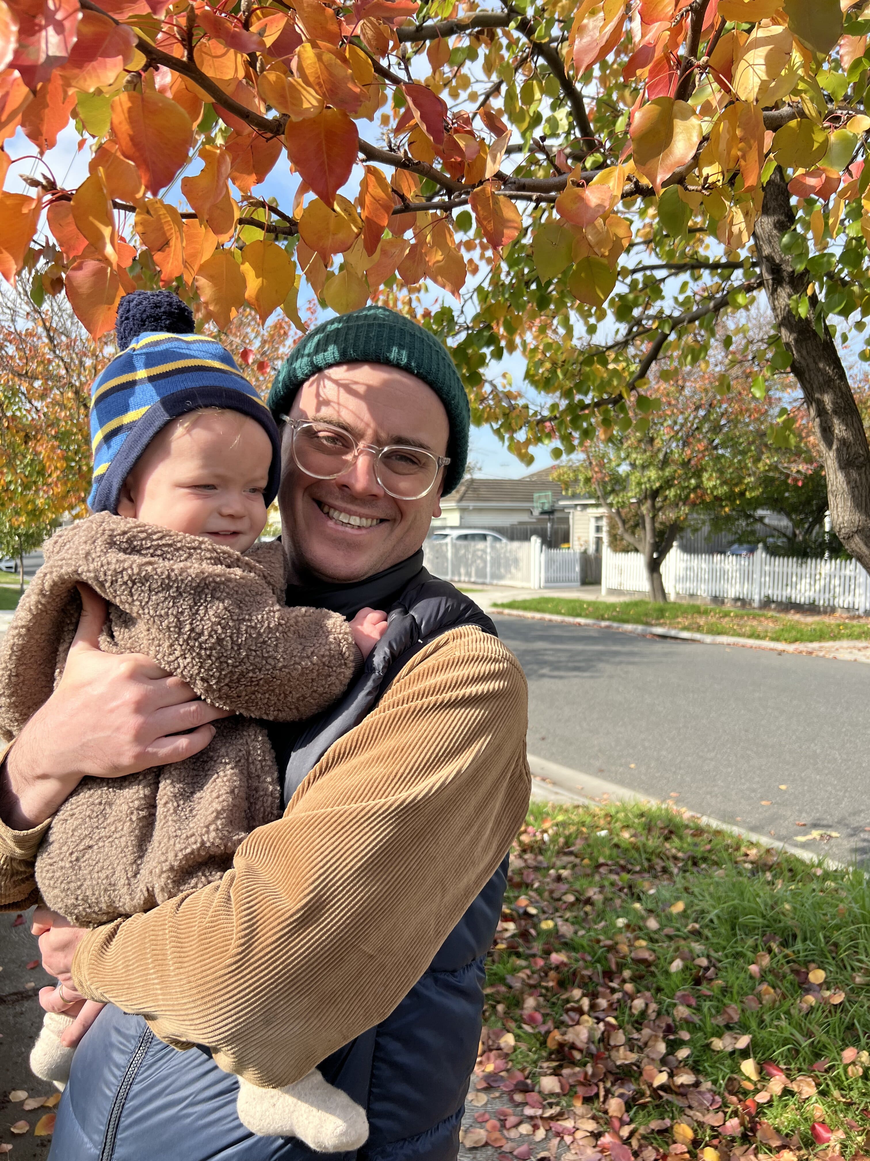 Maximilien Beal holding a child